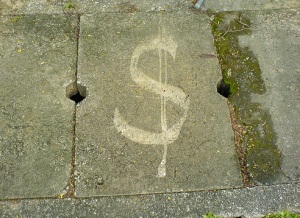 Dollar sign on footpath